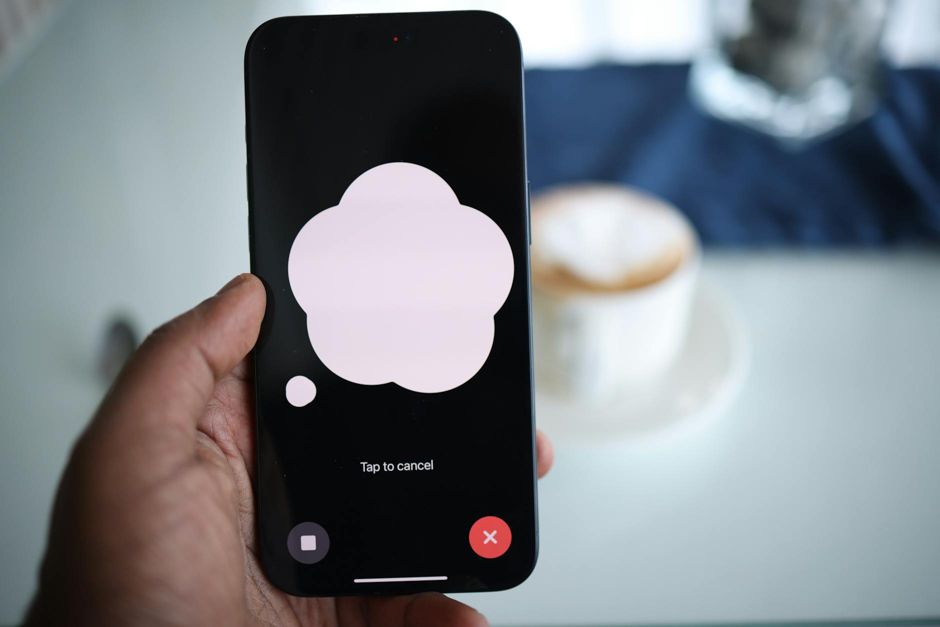 a person holding an iphone with a speech bubble